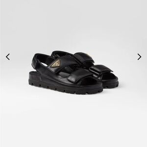 Prada Flat nappa leather sandals. Black